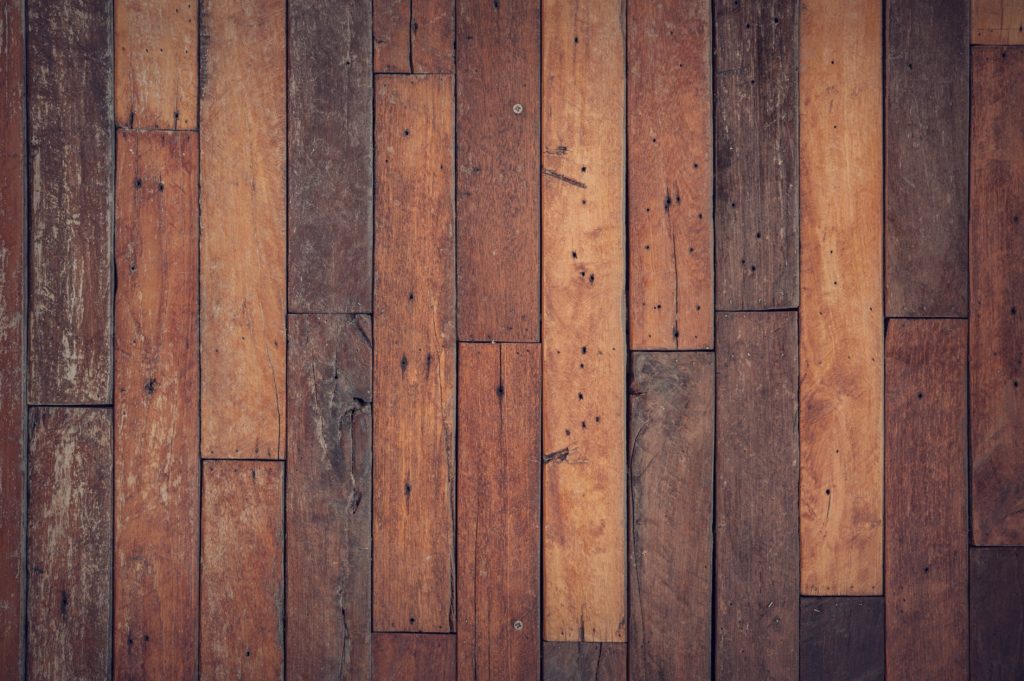 Designing with conscience: reclaimed wood floor viewed from above.
