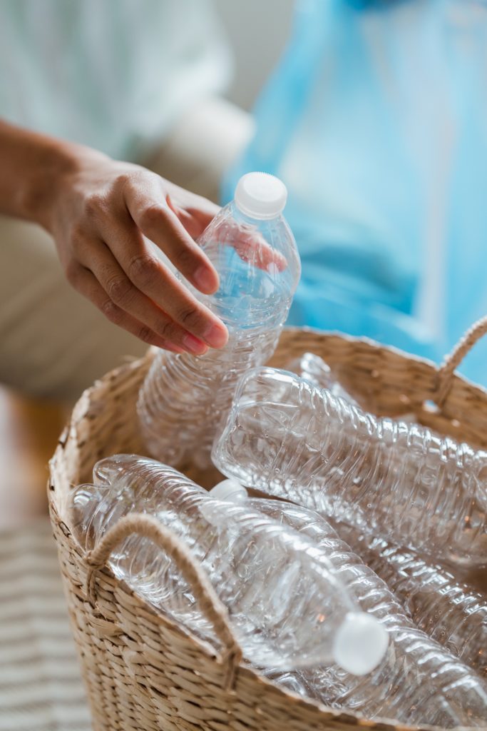 Plastic bottles in wicker basket.